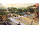 Community playground area with covered picnic tables, ample seating, walking paths and green space at 10039 W Verde Ln, Avondale, AZ 85392