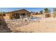 Backyard featuring an in-ground pool surrounded by seating with an encompassing security fence at 10287 S 175Th Ave, Goodyear, AZ 85338