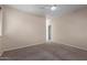 Bedroom features carpet flooring, a ceiling fan, window and closet at 10287 S 175Th Ave, Goodyear, AZ 85338