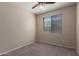 Cozy bedroom featuring a ceiling fan and a window providing natural light at 10287 S 175Th Ave, Goodyear, AZ 85338