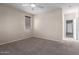 Bedroom features carpet flooring, a ceiling fan, window with blinds and a closet at 10287 S 175Th Ave, Goodyear, AZ 85338