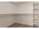 Spacious walk-in closet with multiple shelves and hanging rods for ample storage at 10287 S 175Th Ave, Goodyear, AZ 85338