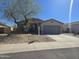 Single-story home featuring desert landscaping, attached garage, and covered porch at 10287 S 175Th Ave, Goodyear, AZ 85338
