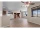 Inviting living room with tile flooring and a custom built-in entertainment center at 10287 S 175Th Ave, Goodyear, AZ 85338