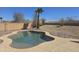 Backyard pool featuring desert landscaping and privacy wall in a relaxing outdoor setting at 10287 S 175Th Ave, Goodyear, AZ 85338
