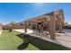 Private backyard with a gazebo and an outdoor seating area perfect for gatherings at 11872 W Sherman St, Avondale, AZ 85323