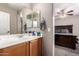 This bathroom has a spacious vanity and a glimpse of a bedroom with a queen bed at 11872 W Sherman St, Avondale, AZ 85323