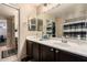 Bathroom featuring a vanity with dark wood cabinets, a mirror, and tile flooring at 11872 W Sherman St, Avondale, AZ 85323