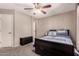 This bedroom features neutral walls, carpet, and a door to the exterior at 11872 W Sherman St, Avondale, AZ 85323