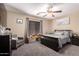 Bedroom featuring a ceiling fan, blinds, carpet, and a gray chair at 11872 W Sherman St, Avondale, AZ 85323