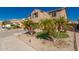 Two-story home featuring lush landscaping, manicured yard, and a well-maintained exterior at 11872 W Sherman St, Avondale, AZ 85323