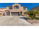 Charming two-story home with a three-car garage and beautiful desert landscaping in front at 11872 W Sherman St, Avondale, AZ 85323