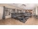 Spacious living room with a large sectional sofa, tile floors, and lots of natural light at 11872 W Sherman St, Avondale, AZ 85323
