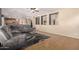 Bright living area with decorative cut outs, a comfortable sectional sofa, and tile flooring at 11872 W Sherman St, Avondale, AZ 85323
