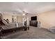 Bright and airy main bedroom featuring a bed, closet, and plush carpeting at 11872 W Sherman St, Avondale, AZ 85323