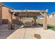 Cozy covered patio with a ceiling fan and outdoor seating offers a relaxing entertainment space at 11872 W Sherman St, Avondale, AZ 85323