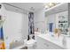 Clean bathroom featuring a shower-tub combo and vanity with storage at 12123 W Bell Rd # 315, Surprise, AZ 85378