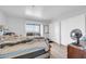 Cozy bedroom with sliding door to a balcony and a neutral color scheme at 12123 W Bell Rd # 315, Surprise, AZ 85378