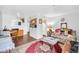 Bright living room with connected dining area and wood flooring throughout at 12123 W Bell Rd # 359, Surprise, AZ 85378
