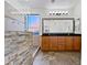 Elegant bathroom featuring a walk-in shower with stone accents and a dual sink vanity at 1227 E Indigo St, Gilbert, AZ 85298