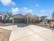 Charming single-story home featuring a two-car garage and desert landscaping under a beautiful blue sky at 1227 E Indigo St, Gilbert, AZ 85298