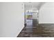 Hallway view of modern living space with an open floor plan and stylish wood flooring at 1227 E Indigo St, Gilbert, AZ 85298