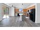 Open kitchen with wood cabinets, stainless steel appliances, granite countertops, and an island at 1227 E Indigo St, Gilbert, AZ 85298