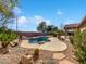 Backyard features a private pool, mature landscaping and a patio for relaxing at 1227 E Indigo St, Gilbert, AZ 85298