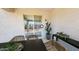 Outdoor patio with wicker seating and a sliding glass door at 12552 W Trumbull Rd, Avondale, AZ 85323