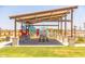 A community picnic shelter and playground is an ideal space for residents to gather, play, and enjoy outdoor activities together at 12552 W Trumbull Rd, Avondale, AZ 85323