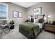 Well-decorated bedroom with modern decor, a cozy bed, and stylish nightstands at 12556 W Trumbull Rd, Avondale, AZ 85323