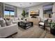 Bright living room with modern decor, comfortable seating, and a stylish rug at 12556 W Trumbull Rd, Avondale, AZ 85323