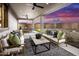 A cozy covered patio with a ceiling fan and comfortable seating, perfect for outdoor entertaining at 12556 W Trumbull Rd, Avondale, AZ 85323