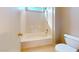 Bright bathroom features a tiled shower-over-tub combination and a toilet at 13253 W Lisbon Ln, Surprise, AZ 85379