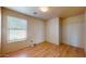 Simple bedroom with laminate flooring, closet, and window providing natural light at 13253 W Lisbon Ln, Surprise, AZ 85379