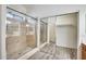 Bathroom featuring a walk-in shower with tiled surround and mirrored closet doors at 15412 N 160Th Ln, Surprise, AZ 85374
