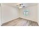 Bright bedroom with laminate flooring and plantation shutters, offering a serene and comfortable atmosphere at 15412 N 160Th Ln, Surprise, AZ 85374