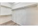 Walk-in closet with multiple shelves and rods for ample storage space at 15412 N 160Th Ln, Surprise, AZ 85374