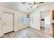 Cozy dining area with wood-look flooring, white walls, and shuttered windows at 15412 N 160Th Ln, Surprise, AZ 85374