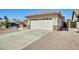 A well-maintained home with a two-car garage, desert landscaping, and a welcoming curb appeal at 15412 N 160Th Ln, Surprise, AZ 85374