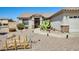 Inviting home exterior with desert landscaping and charming walkway that leads to the front door at 15412 N 160Th Ln, Surprise, AZ 85374