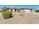 Charming home with desert landscaping, well-manicured bushes, and a two-car garage at 15412 N 160Th Ln, Surprise, AZ 85374