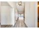 Hallway features neutral walls, vinyl flooring, and natural light coming from the backyard at 15412 N 160Th Ln, Surprise, AZ 85374