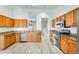 Spacious kitchen featuring ample oak cabinetry and modern appliances at 15412 N 160Th Ln, Surprise, AZ 85374