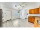Bright kitchen with stainless steel appliances, oak cabinetry, and wood-look flooring at 15412 N 160Th Ln, Surprise, AZ 85374