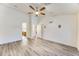 Spacious main bedroom features laminate flooring, a ceiling fan, recessed lighting and access to the ensuite bathroom at 15412 N 160Th Ln, Surprise, AZ 85374