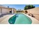 Sparkling pool with cool blue tile, mature foliage, and gravel landscaping at 15412 N 160Th Ln, Surprise, AZ 85374