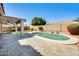 Beautiful backyard pool with tiled patio area, lush green landscaping, and perfect for outdoor entertaining at 15412 N 160Th Ln, Surprise, AZ 85374