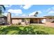 This home features a well maintained backyard, with partial shade and partial grass at 1633 W Andorra Dr, Phoenix, AZ 85029