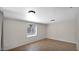 Simple and bright bedroom with tiled floor and ample natural light at 1633 W Andorra Dr, Phoenix, AZ 85029